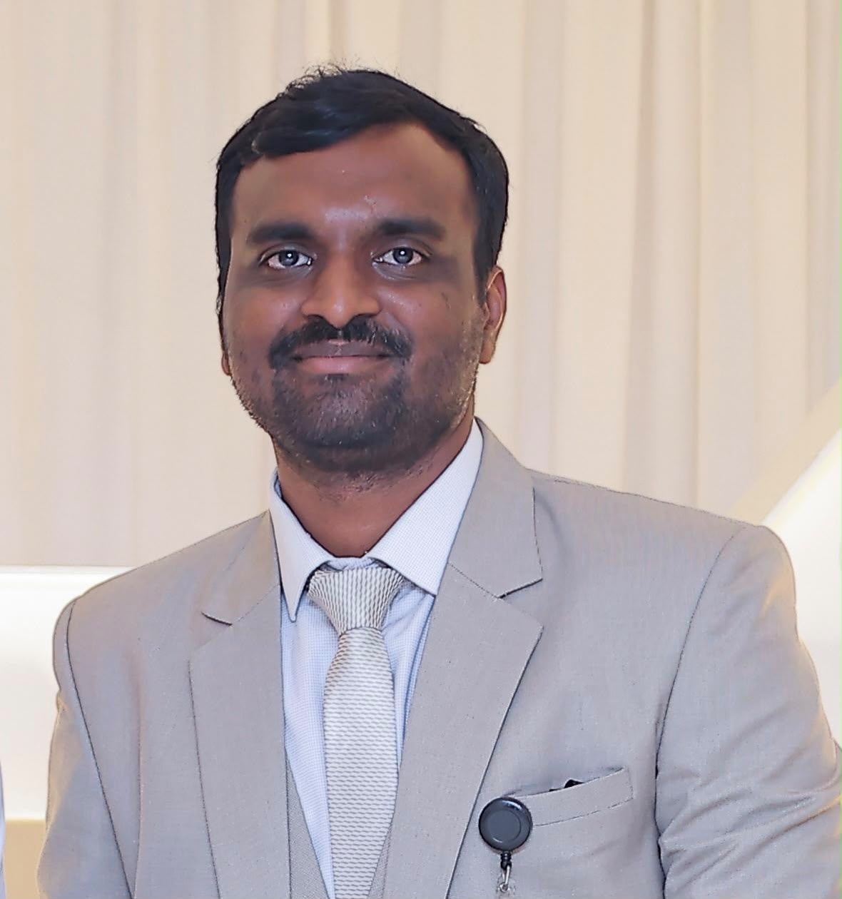 Dr. Yakhub Mohammed in grey suit
